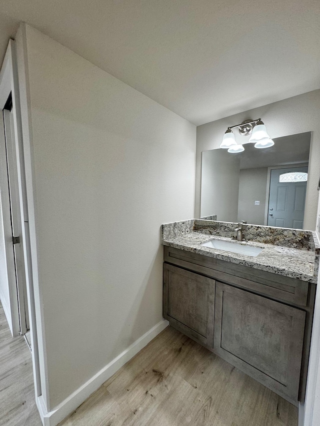 16-2045 Hanale Dr, Pahoa, HI 96778 - bathroom with wood finished floors, vanity, and baseboards