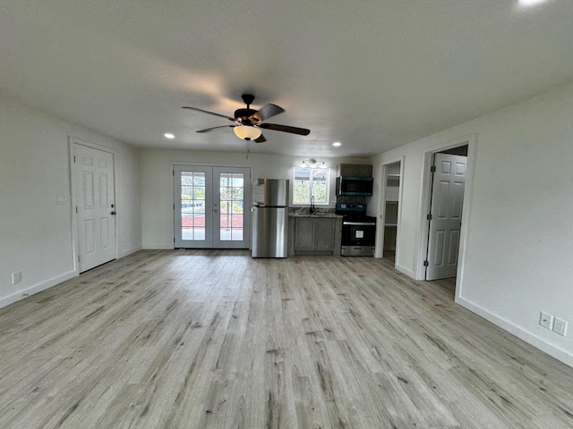 16-2045 Hanale Dr, Pahoa, HI 96778 - unfurnished living room with french doors, baseboards, a ceiling fan, light wood-style floors, and recessed lighting