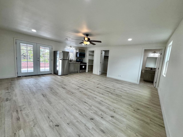 16-2045 Hanale Dr, Pahoa, HI 96778 - unfurnished living room featuring french doors, light wood finished floors, ceiling fan, baseboards, and recessed lighting
