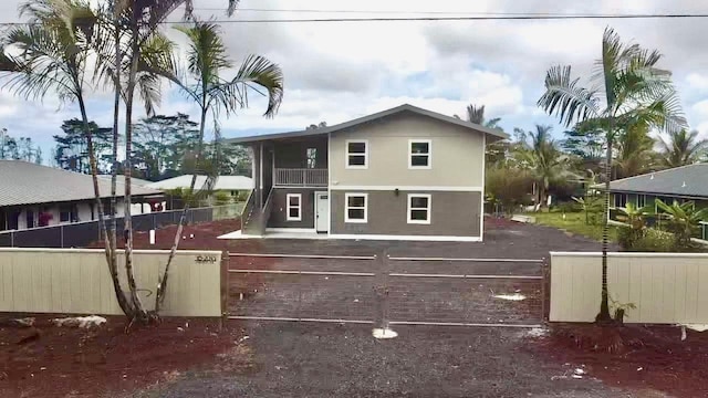 16-2045 Hanale Dr, Pahoa, HI 96778 - back of property featuring a balcony and stucco siding