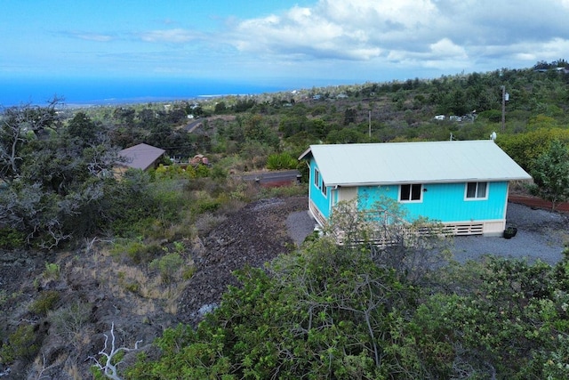 92-8260 Bamboo Ln, Ocean View, HI 96737 - aerial view of property and surrounding area with a forest