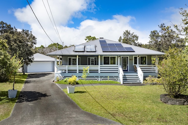 99-1808 Kilau Way, Volcano, HI 96785 - view of front of house featuring covered porch, an outdoor structure, a front lawn, and a garage