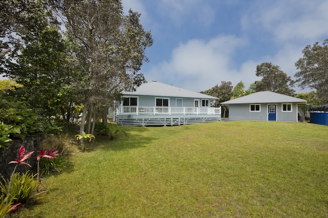 99-1808 Kilau Way, Volcano, HI 96785 - rear view of property featuring a wooden deck and a lawn