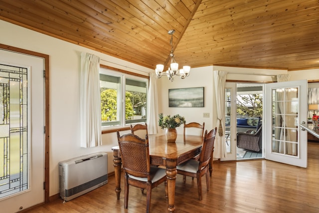 99-1808 Kilau Way, Volcano, HI 96785 - dining space featuring wooden ceiling, a chandelier, wood finished floors, vaulted ceiling, and heating unit