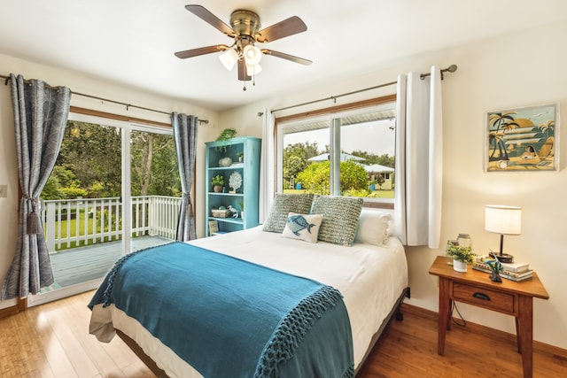 99-1808 Kilau Way, Volcano, HI 96785 - bedroom featuring access to outside, wood finished floors, and a ceiling fan
