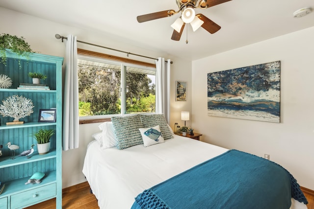 99-1808 Kilau Way, Volcano, HI 96785 - bedroom with a ceiling fan and wood finished floors