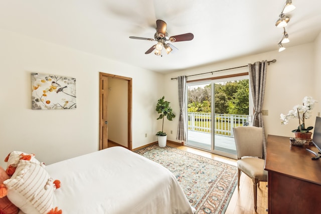 99-1808 Kilau Way, Volcano, HI 96785 - bedroom with access to exterior, light wood finished floors, ceiling fan, and an office area