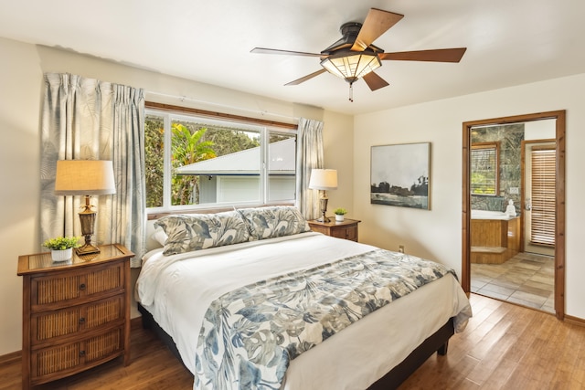 99-1808 Kilau Way, Volcano, HI 96785 - bedroom featuring multiple windows, wood finished floors, and connected bathroom