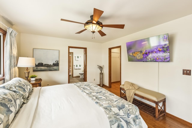 99-1808 Kilau Way, Volcano, HI 96785 - bedroom featuring wood finished floors, a spacious closet, ceiling fan, a closet, and ensuite bath