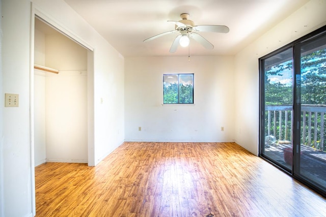 3351 Kalua Moa Rd, Koloa, HI 96756 - unfurnished bedroom with access to outside, light wood-type flooring, and a ceiling fan