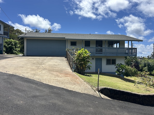4666 Hauaala Rd Unit 1, Kapaa, HI 96746 - view of front facade with a front lawn, an attached garage, driveway, a balcony, and roof with shingles