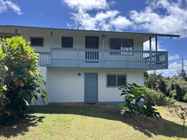 4666 Hauaala Rd Unit 1, Kapaa, HI 96746 - view of front of property with a balcony and a front lawn