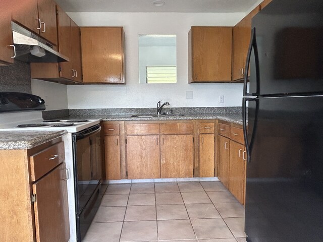 4666 Hauaala Rd Unit 1, Kapaa, HI 96746 - kitchen with black appliances, a sink, under cabinet range hood, dark countertops, and brown cabinetry