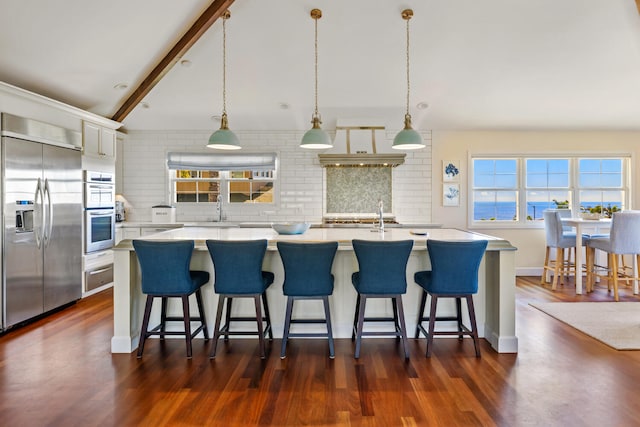 3764 Kakela Makai Dr, Kalaheo, HI 96741 - kitchen featuring stainless steel appliances, backsplash, light countertops, white cabinetry, and a warming drawer