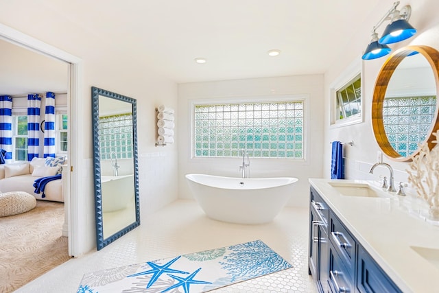 3764 Kakela Makai Dr, Kalaheo, HI 96741 - bathroom featuring double vanity, a soaking tub, and tile patterned flooring