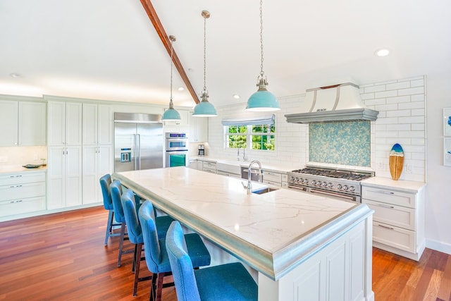 3764 Kakela Makai Dr, Kalaheo, HI 96741 - kitchen with premium range hood, high quality appliances, recessed lighting, decorative backsplash, and wood finished floors
