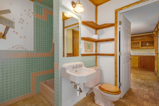 66-1665-A Kawaihae Rd, Kamuela, HI 96743 - full bathroom featuring tile walls, brick patterned floors, and shower / washtub combination