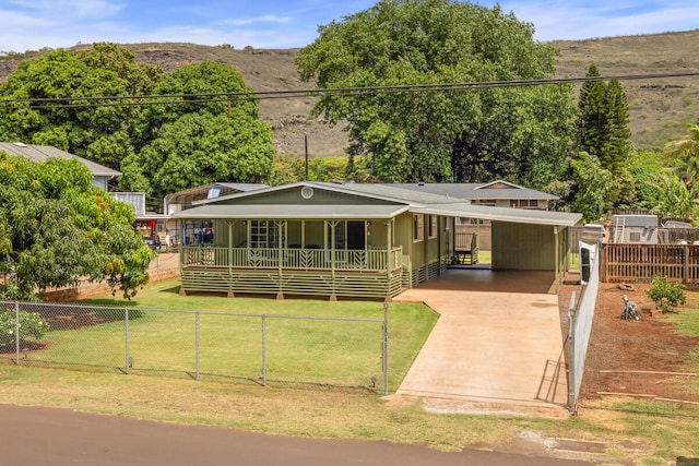 5045 Menehune Rd, Waimea, HI 96796 - view of front of house with concrete driveway and an attached carport
