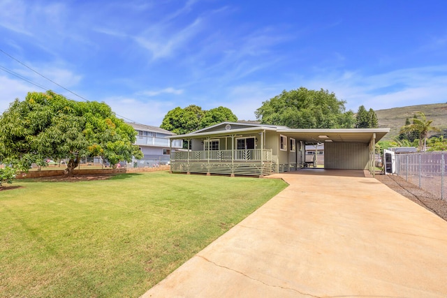 5045 Menehune Rd, Waimea, HI 96796 - view of front of home with concrete driveway, an attached carport, and a porch