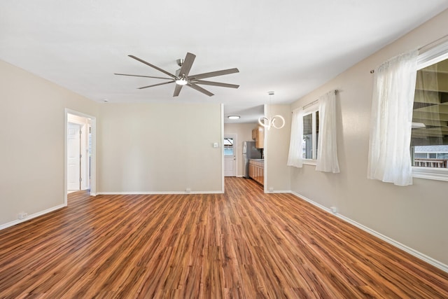 5045 Menehune Rd, Waimea, HI 96796 - unfurnished living room featuring wood finished floors and a ceiling fan