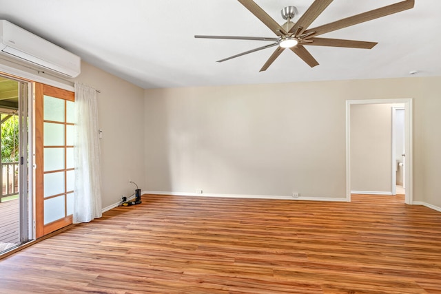 5045 Menehune Rd, Waimea, HI 96796 - spare room with an AC wall unit, light wood finished floors, and ceiling fan