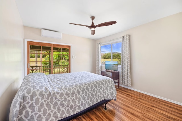5045 Menehune Rd, Waimea, HI 96796 - bedroom with a wall mounted air conditioner, access to outside, wood finished floors, and a ceiling fan