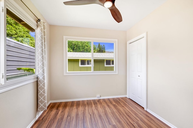 5045 Menehune Rd, Waimea, HI 96796 - empty room with wood finished floors and ceiling fan