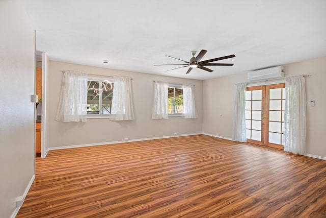 5045 Menehune Rd, Waimea, HI 96796 - spare room with a wall mounted AC, wood finished floors, and a ceiling fan