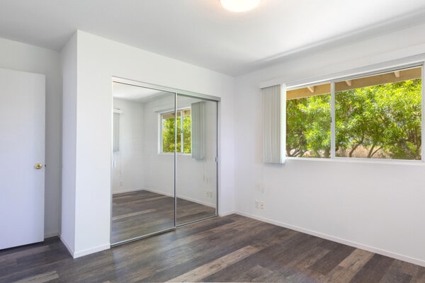 68-3750 Ua Noe Pl, Waikoloa, HI 96738 - unfurnished bedroom featuring wood finished floors, a closet, and baseboards
