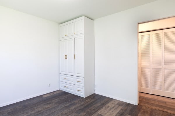 68-3750 Ua Noe Pl, Waikoloa, HI 96738 - unfurnished bedroom featuring dark wood-style floors and baseboards