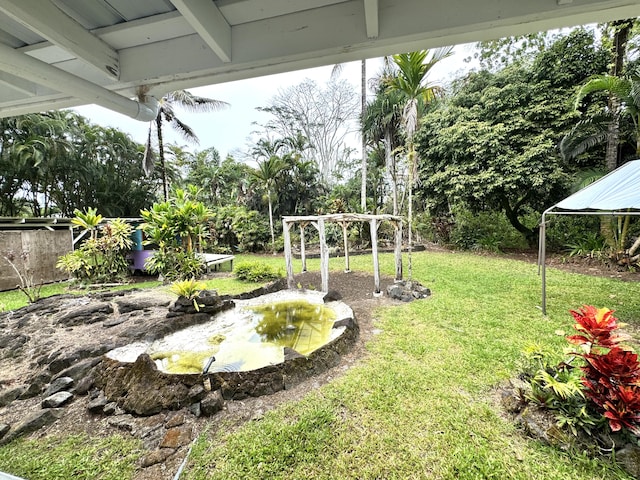15-2015 12th Ave, Keaau, HI 96749 - view of green lawn with a small pond