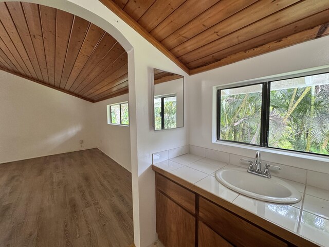 15-2015 12th Ave, Keaau, HI 96749 - bathroom with wood ceiling, vaulted ceiling, wood finished floors, and vanity