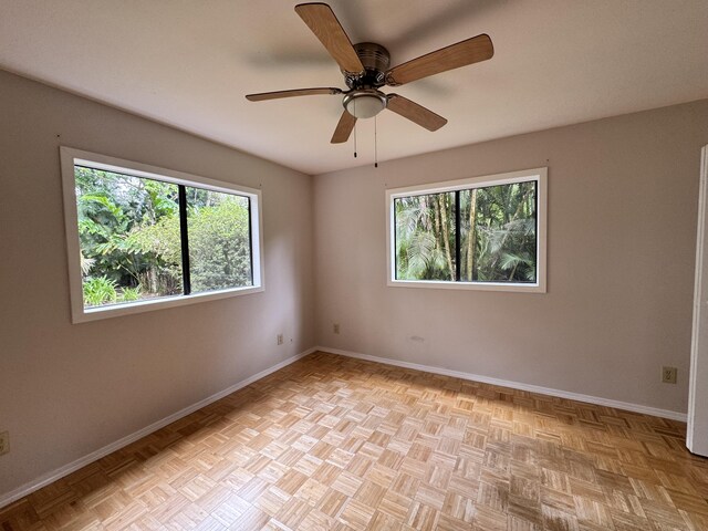 15-2015 12th Ave, Keaau, HI 96749 - spare room with healthy amount of natural light, baseboards, and ceiling fan