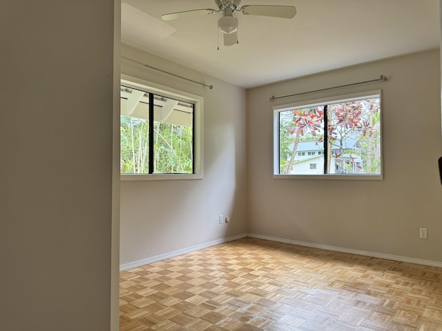 15-2015 12th Ave, Keaau, HI 96749 - spare room with plenty of natural light, ceiling fan, and baseboards