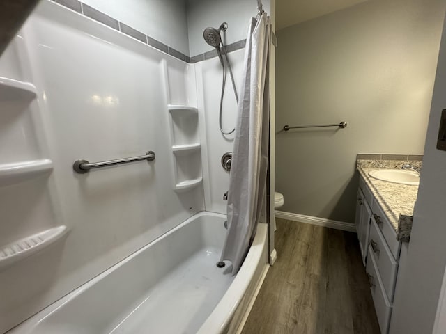 75-6008 Alii Dr Unit 234, Kailua-Kona, HI 96740 - bathroom featuring wood finished floors, vanity, shower / bathtub combination with curtain, baseboards, and toilet