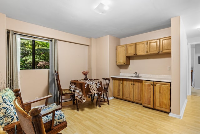 11-3827 5th St, Volcano, HI 96785 - kitchen with light wood-style floors, a sink, light countertops, and baseboards