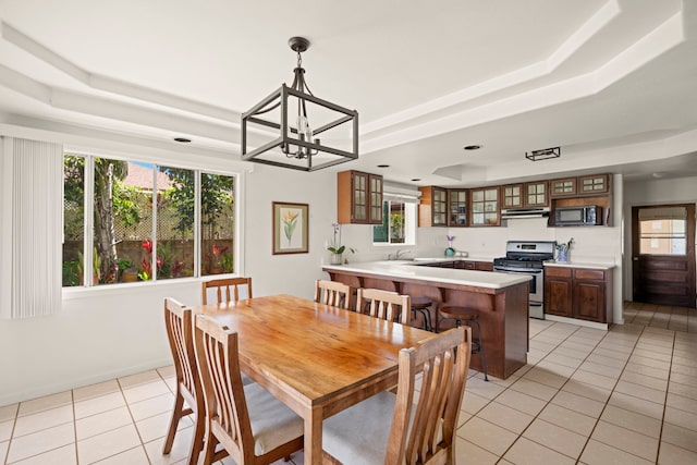 2640 Keoki Pl, Kalaheo, HI 96741 - dining area with a raised ceiling, light tile patterned flooring, and a chandelier