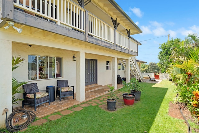 2640 Keoki Pl, Kalaheo, HI 96741 - view of grassy yard featuring french doors, stairs, a patio area, and a balcony