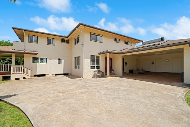 2640 Keoki Pl, Kalaheo, HI 96741 - back of house with a patio, stucco siding, outdoor lounge area, and a wooden deck