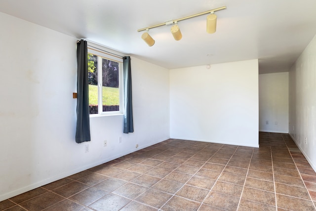 64-660 Puu Olu Pl, Kamuela, HI 96743 - empty room featuring rail lighting and baseboards