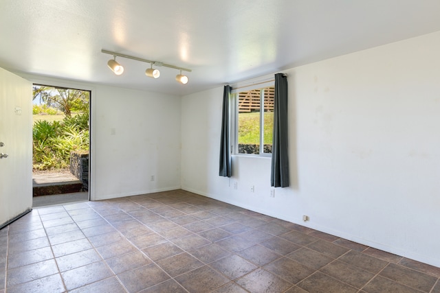 64-660 Puu Olu Pl, Kamuela, HI 96743 - empty room featuring baseboards and rail lighting