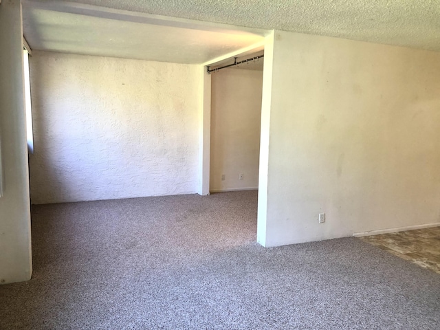 360 Kauila St Unit 203, Hilo, HI 96720 - spare room with carpet floors and a textured ceiling
