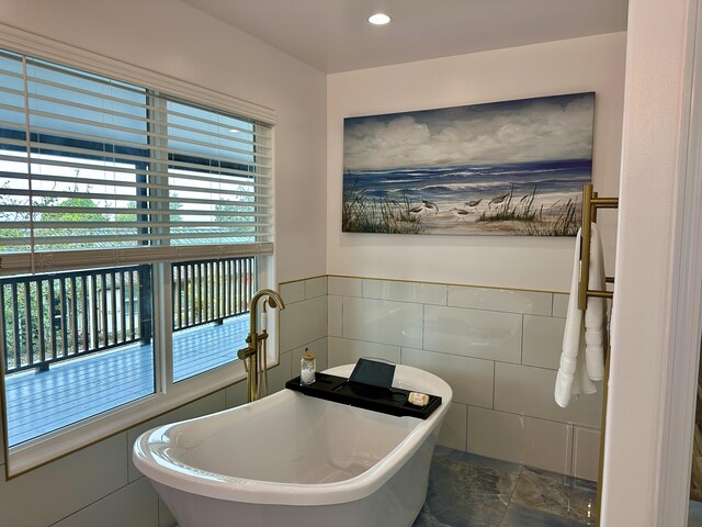 64-5304 Puu Nani Dr, Kamuela, HI 96743 - bathroom featuring a freestanding bath, tile walls, a wainscoted wall, and recessed lighting