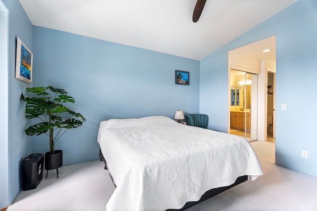 75-6009 Alii Dr Unit K22, Kailua-Kona, HI 96740 - bedroom featuring carpet floors, vaulted ceiling, connected bathroom, and ceiling fan