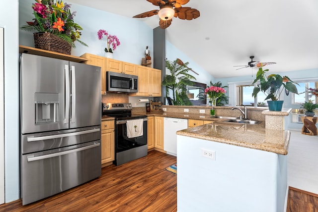75-6009 Alii Dr Unit K22, Kailua-Kona, HI 96740 - kitchen featuring appliances with stainless steel finishes, ceiling fan, a sink, light brown cabinetry, and vaulted ceiling