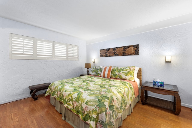 75-6082 Alii Dr Unit B236, Kailua-Kona, HI 96740 - bedroom featuring wood finished floors and baseboards
