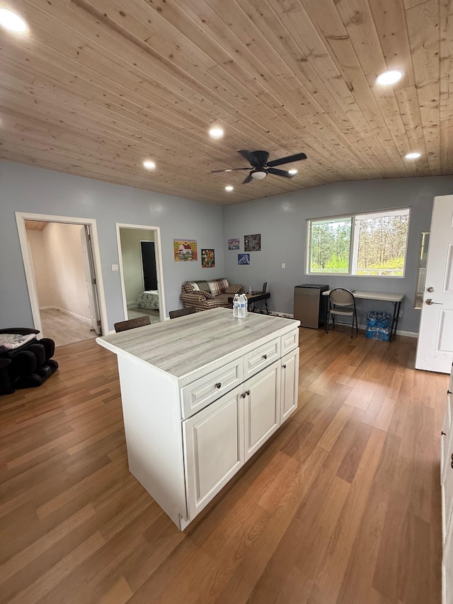 11-2828 Lehua St, Mountain View, HI 96771 - kitchen with wood ceiling, white cabinetry, light wood finished floors, a kitchen island, and recessed lighting