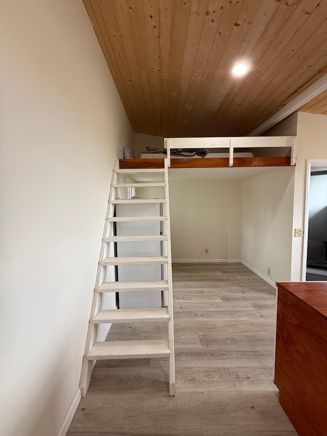 11-2828 Lehua St, Mountain View, HI 96771 - staircase with wood ceiling, wood finished floors, and baseboards