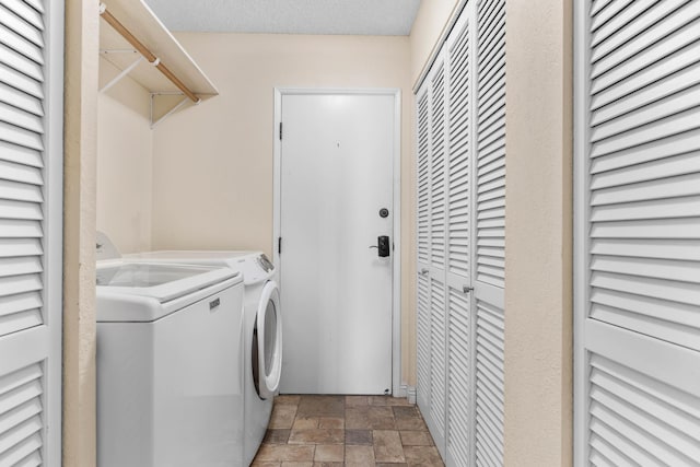 73-4332 Imo Pl, Kailua-Kona, HI 96740 - laundry area with washer and clothes dryer and stone finish flooring