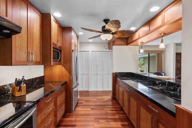 73-4332 Imo Pl, Kailua-Kona, HI 96740 - kitchen featuring extractor fan, wood finished floors, a ceiling fan, stainless steel appliances, and brown cabinets